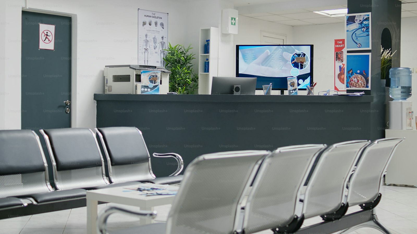 An empty waiting area and reception desk in a private clinic