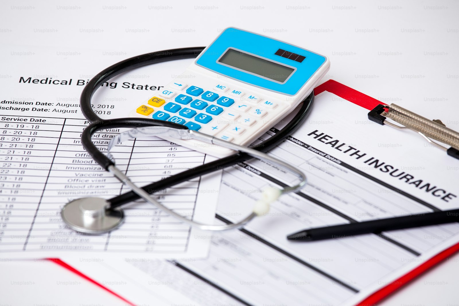 A stethoscope beside a calculator, the cost of medical care