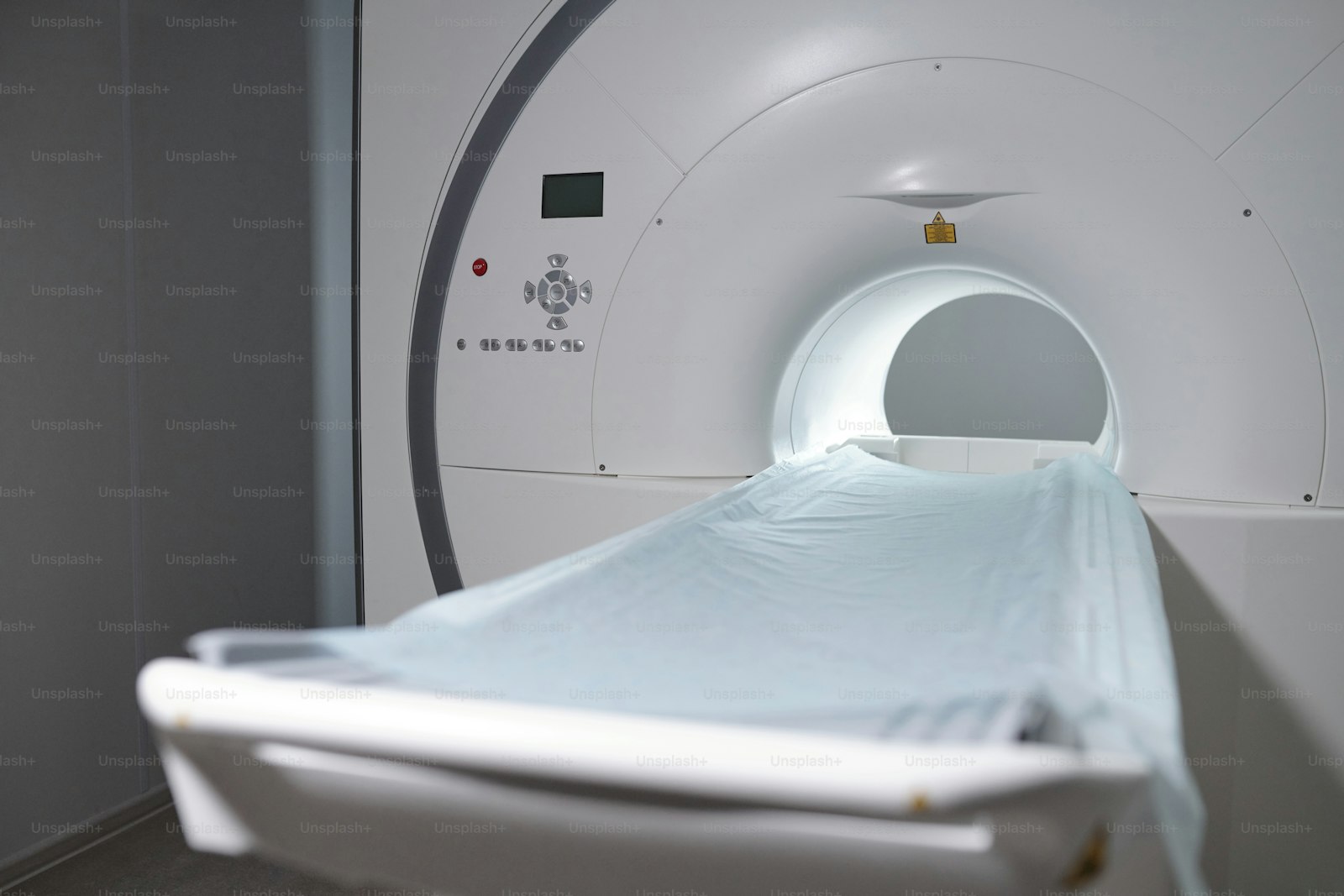 An MRI scanner and patient table in a contemporary clinic
