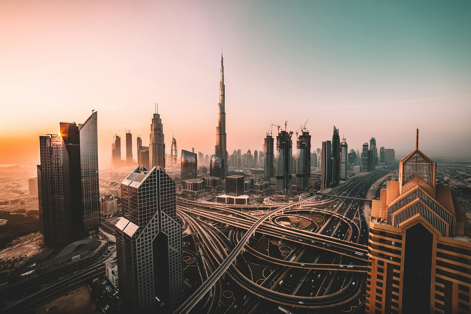 The Burj Khalifa and surrounding towers above a multi-level interchange