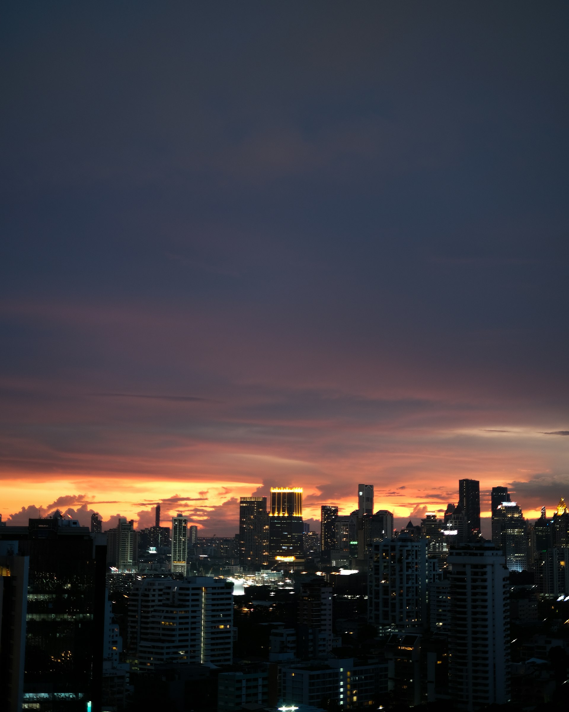 Bangkok skyline glowing at sunset